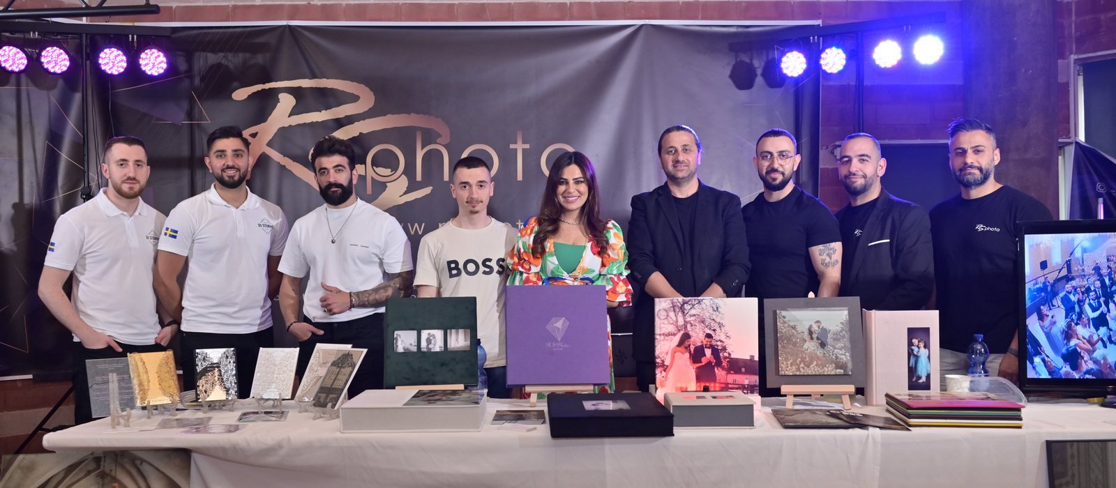 The SANAD Company team at a branded exhibition booth during a client event